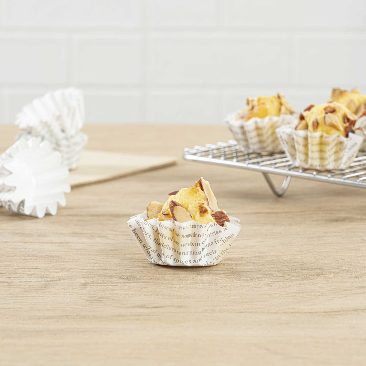 Panificio 0.4 oz Round Newsprint Paper Mini Baking Cup - Flared - 2" x 2" x 1/2" - 200 count box