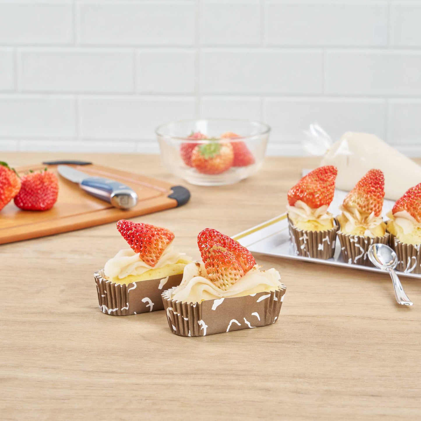 Panificio 1 oz Elliptical Chocolate Wisp Paper Regular Baking Cup - Ridged - 3 1/2" x 1 1/2" x 1" - 200 count box