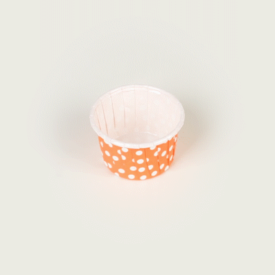 Panificio 2 oz Round Polka-Dotted Hot Orange Paper Medium Baking Cup - Pleated - 2 1/4" x 2 1/4" x 1 1/2" - 200 count box