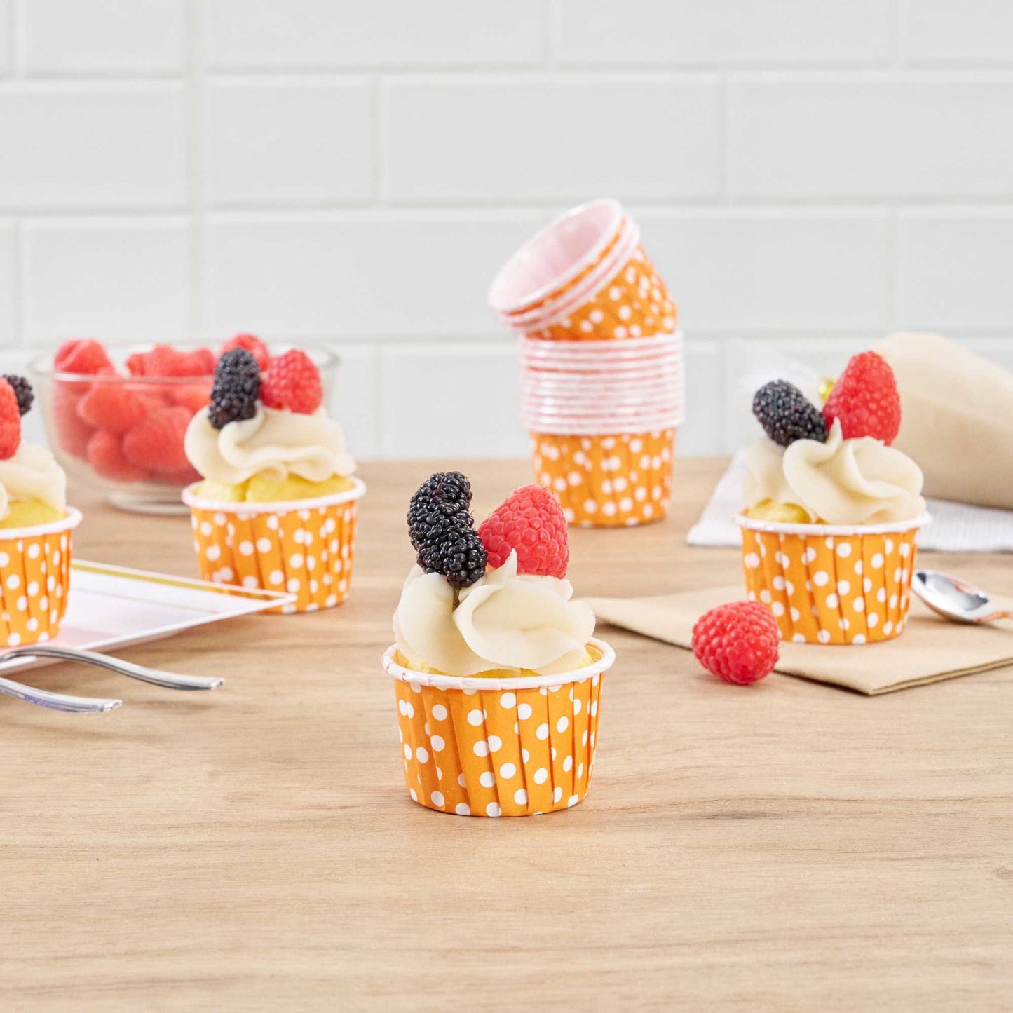 Panificio 2 oz Round Polka-Dotted Hot Orange Paper Medium Baking Cup - Pleated - 2 1/4" x 2 1/4" x 1 1/2" - 200 count box