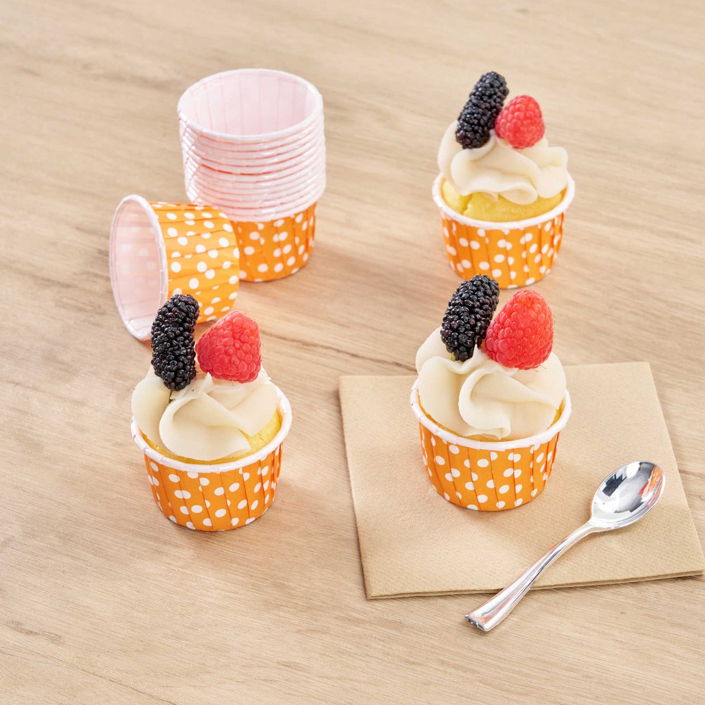 Panificio 2 oz Round Polka-Dotted Hot Orange Paper Medium Baking Cup - Pleated - 2 1/4" x 2 1/4" x 1 1/2" - 200 count box