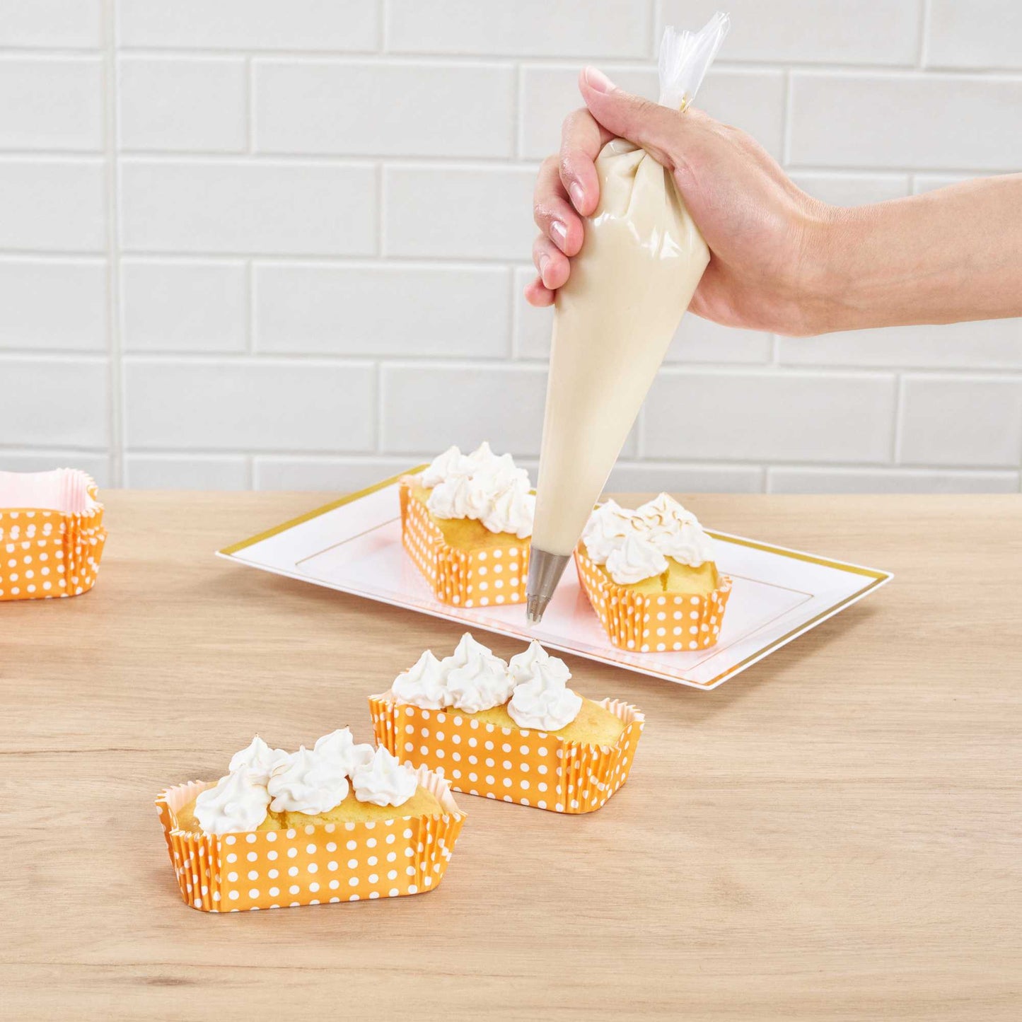 Panificio 5 oz Elliptical Polka-Dotted Hot Orange Paper Large Baking Cup - Ridged - 4 1/2" x 2 1/2" x 1 1/4" - 200 count box