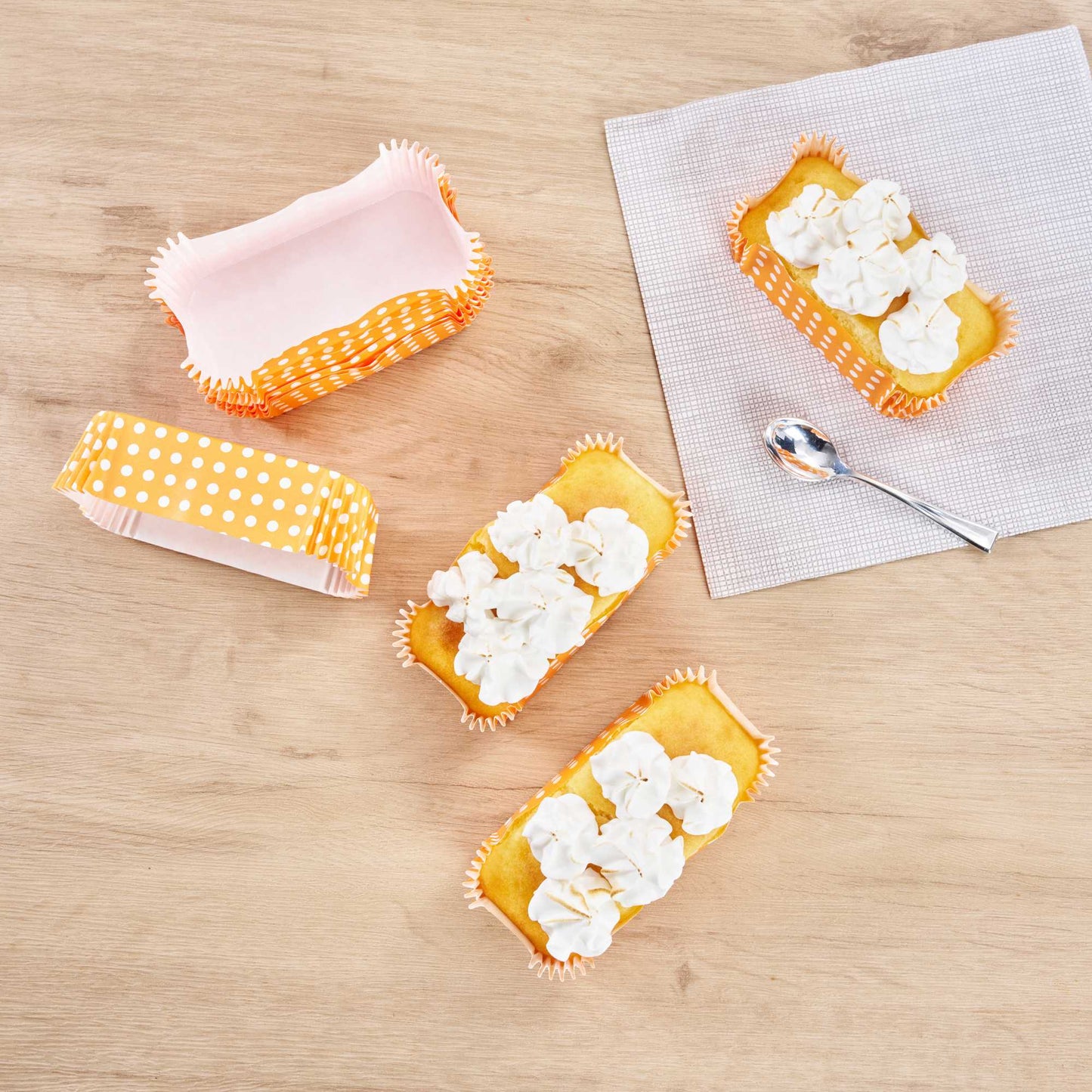 Panificio 5 oz Elliptical Polka-Dotted Hot Orange Paper Large Baking Cup - Ridged - 4 1/2" x 2 1/2" x 1 1/4" - 200 count box