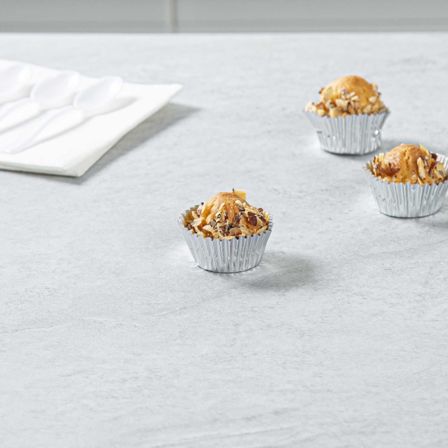Panificio 0.4 oz Round Metallic Silver Paper Baking Cup - Foil-Coated - 1 1/4" x 1 1/4" x 3/4" - 200 count box