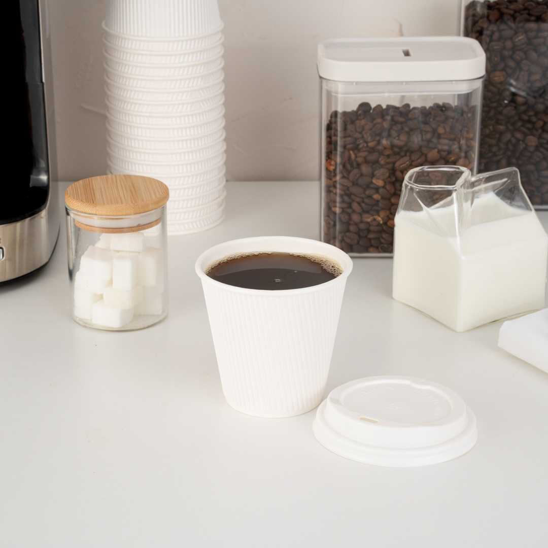 Restpresso 8 oz White Paper Coffee Cup - Ripple Wall - 3 1/2" x 3 1/2" x 3 1/4" - 25 count box