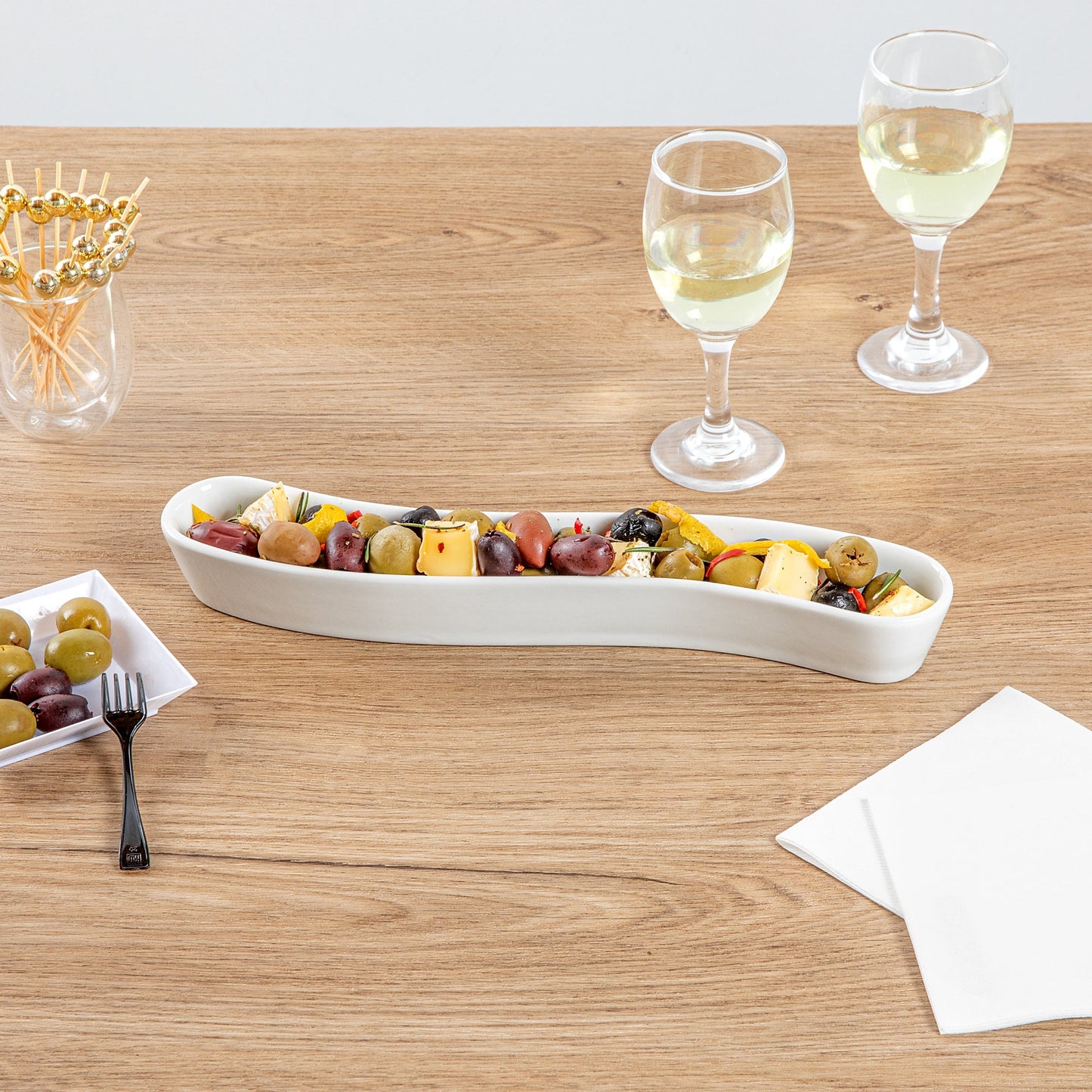 Chef 101 Swerve 10 oz Curved White Porcelain Olive Plate - 12" x 2 1/2" x 1 1/2" - 1 count box