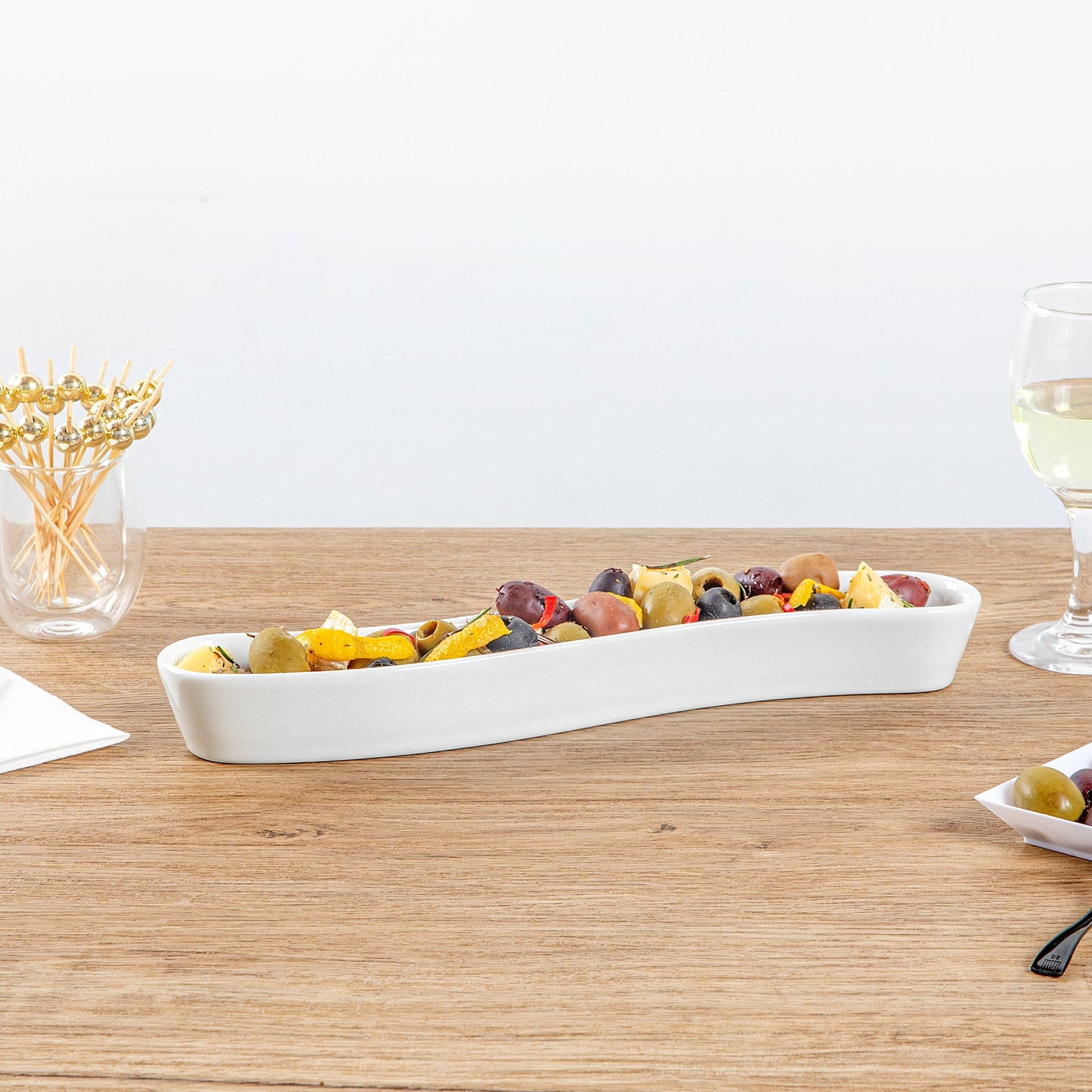 Chef 101 Swerve 10 oz Curved White Porcelain Olive Plate - 12" x 2 1/2" x 1 1/2" - 1 count box