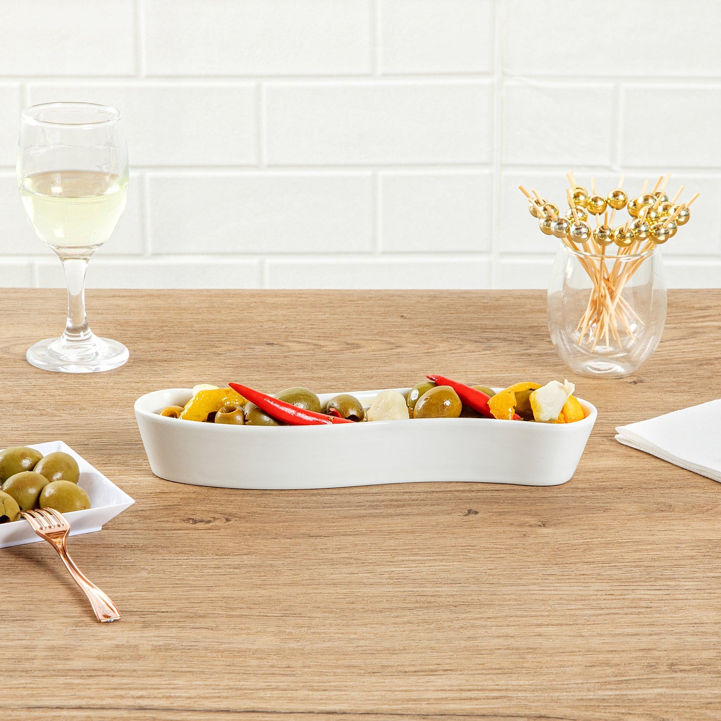 Chef 101 Swerve 6 oz Curved White Porcelain Olive Plate - 8 3/4" x 2 1/4" x 1 1/2" - 1 count box