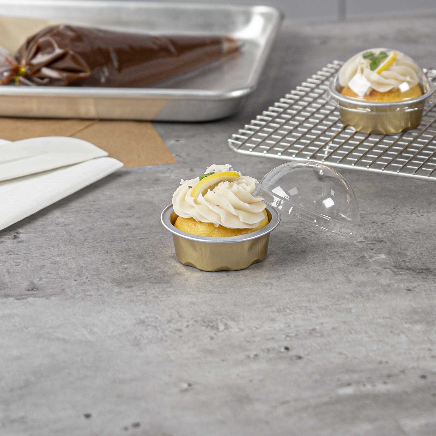 Pastry Tek 2 oz Round Gold Aluminum Baking Cup - with Plastic Dome Lid - 2 3/4" x 2 3/4" x 1" - 100 count box