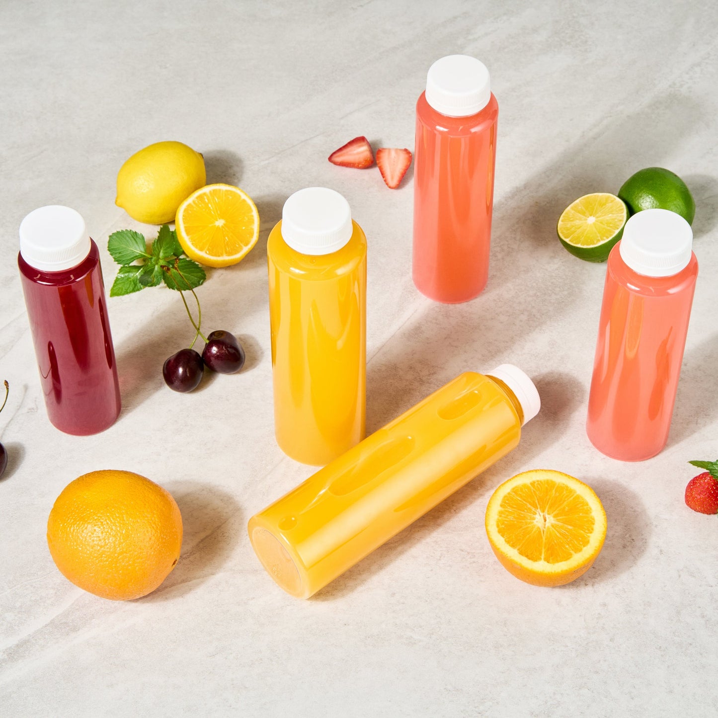 Bottle Tek 16 oz Round Clear Plastic Cold Pressed Juice Bottle - with Safety Cap - 2 1/4" x 2 1/4" x 8 1/4" - 100 count box