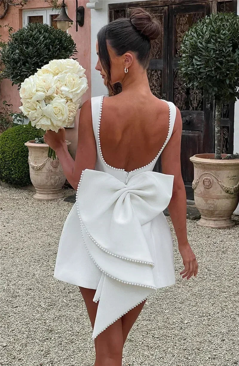 Mozision Pearl Bow Backless Sexy Mini Dress For Women Robe Fashion Zipper Sleeveless High Waist A-line Club Party Dress Elegant